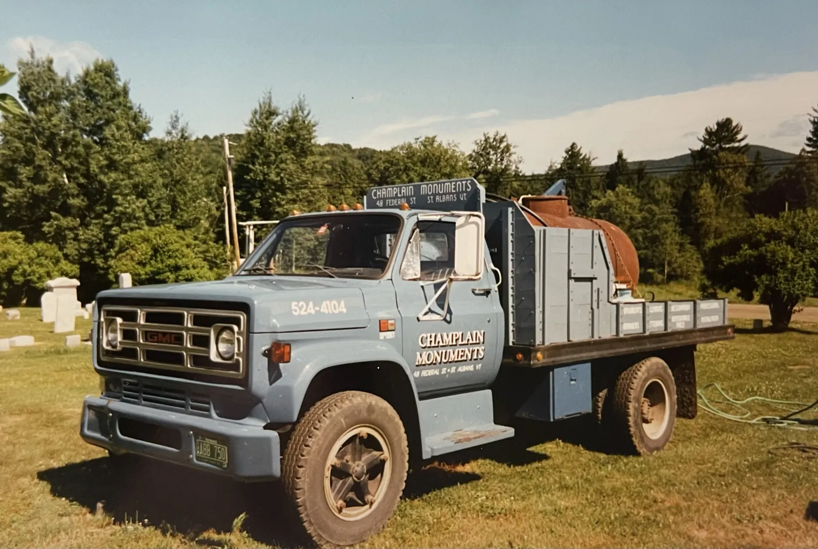 Early Champlain Monuments service truck with 48 Federal Street, St. Albans signage and the original 524-4104 phone number