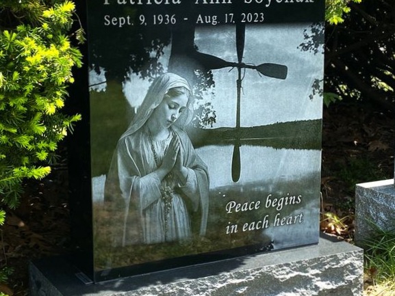 Laser-etched custom scene on polished black granite
