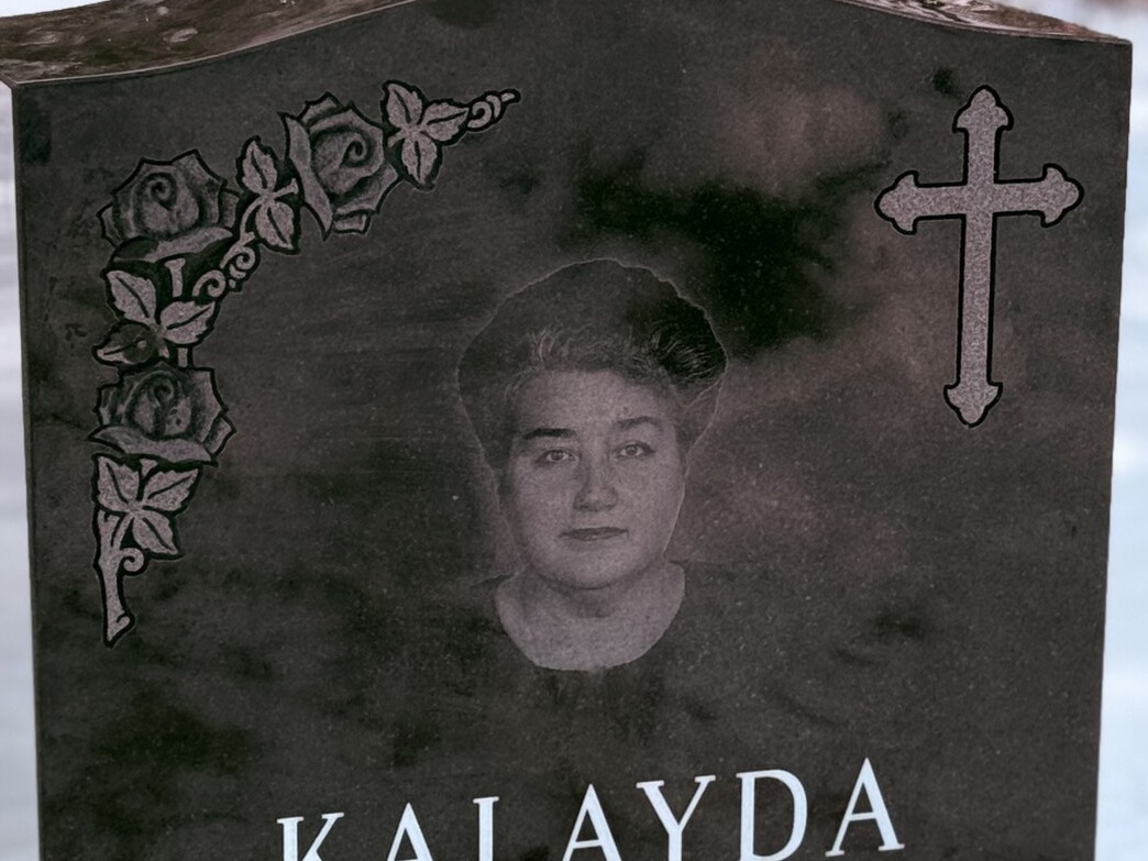 Laser-etched portrait on polished black granite