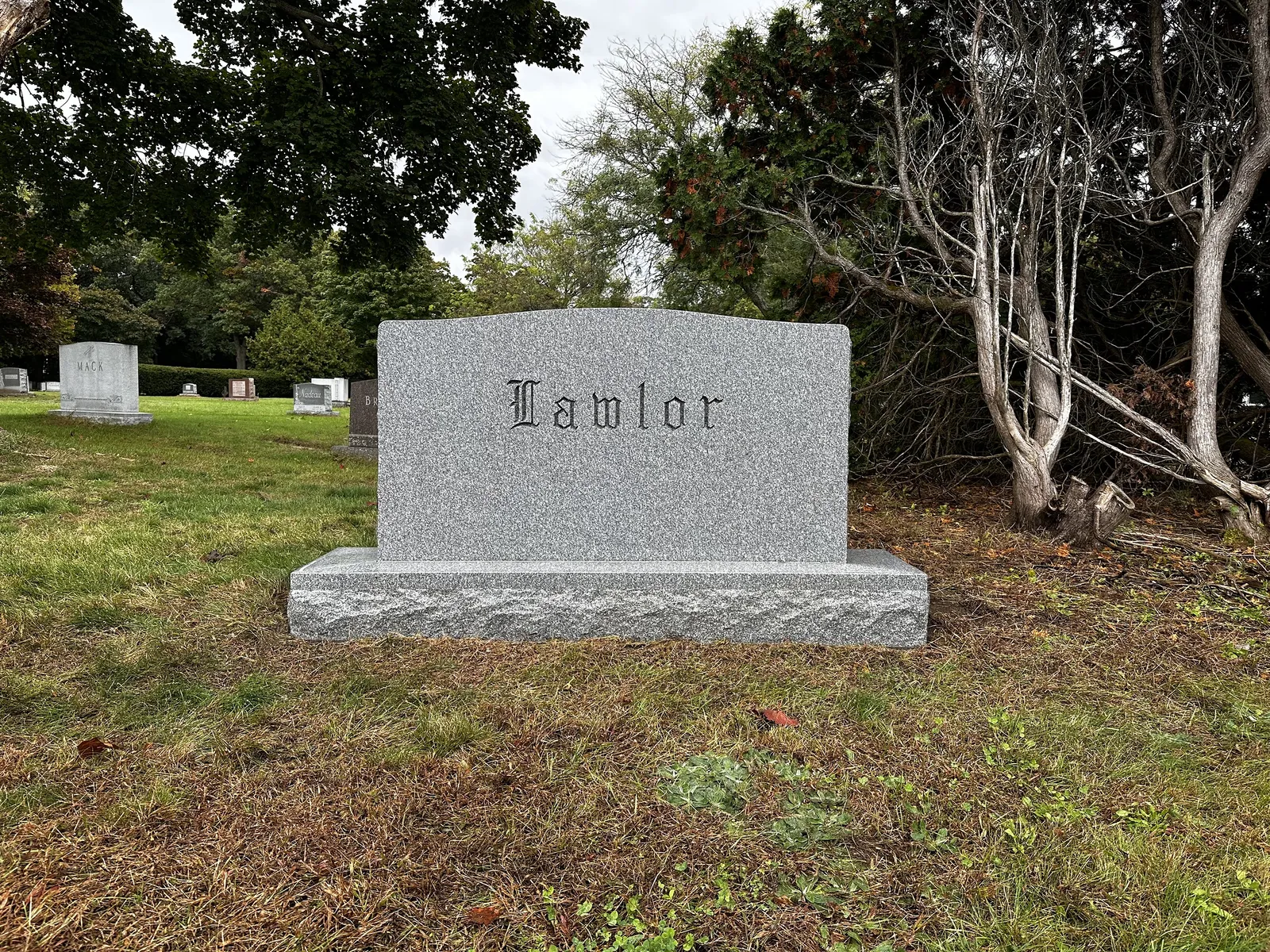 The same Lawlor upright monument after cleaning, with lettering restored to readability