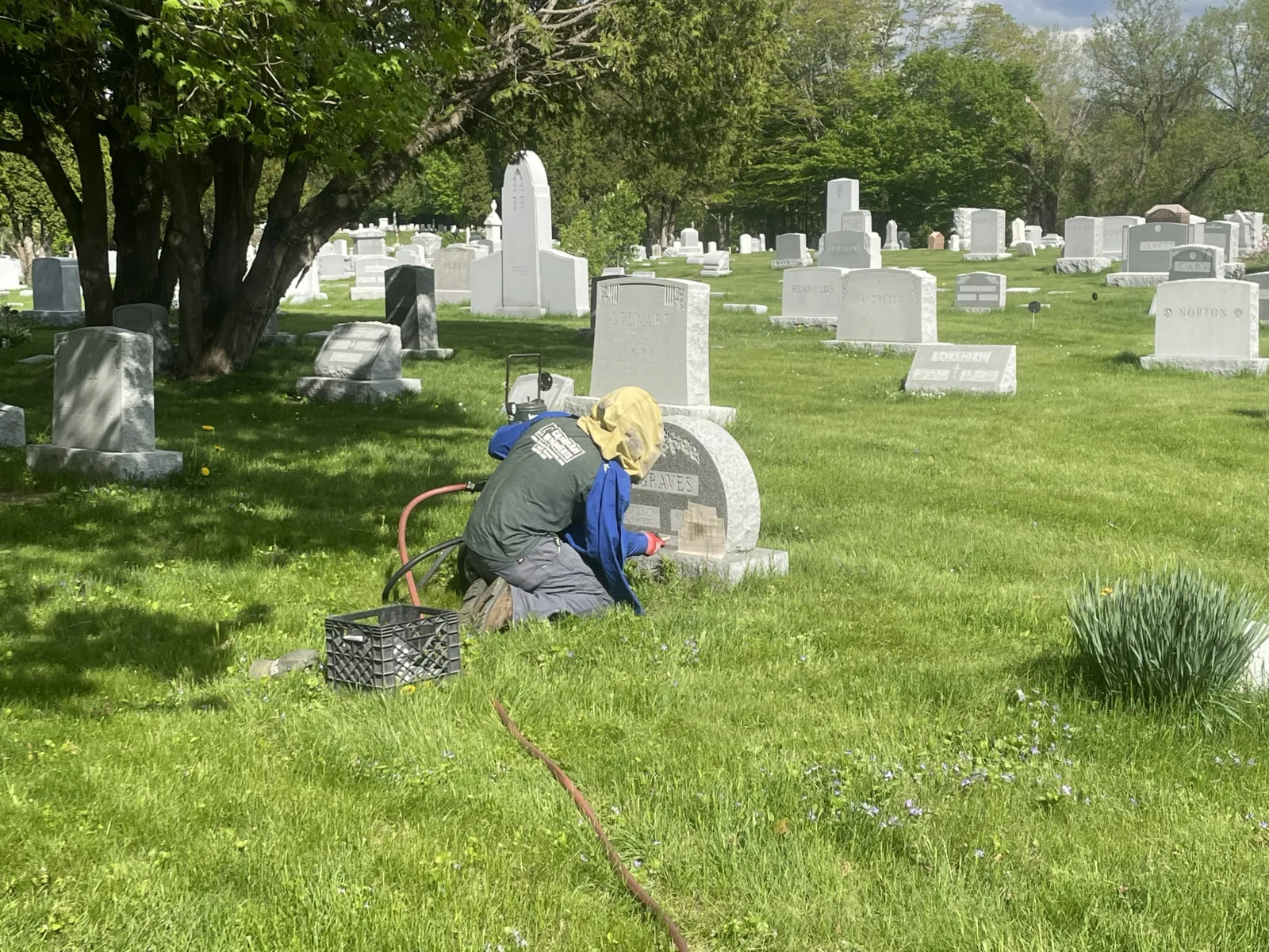 Sandblast engraving being added to a granite monument on-site