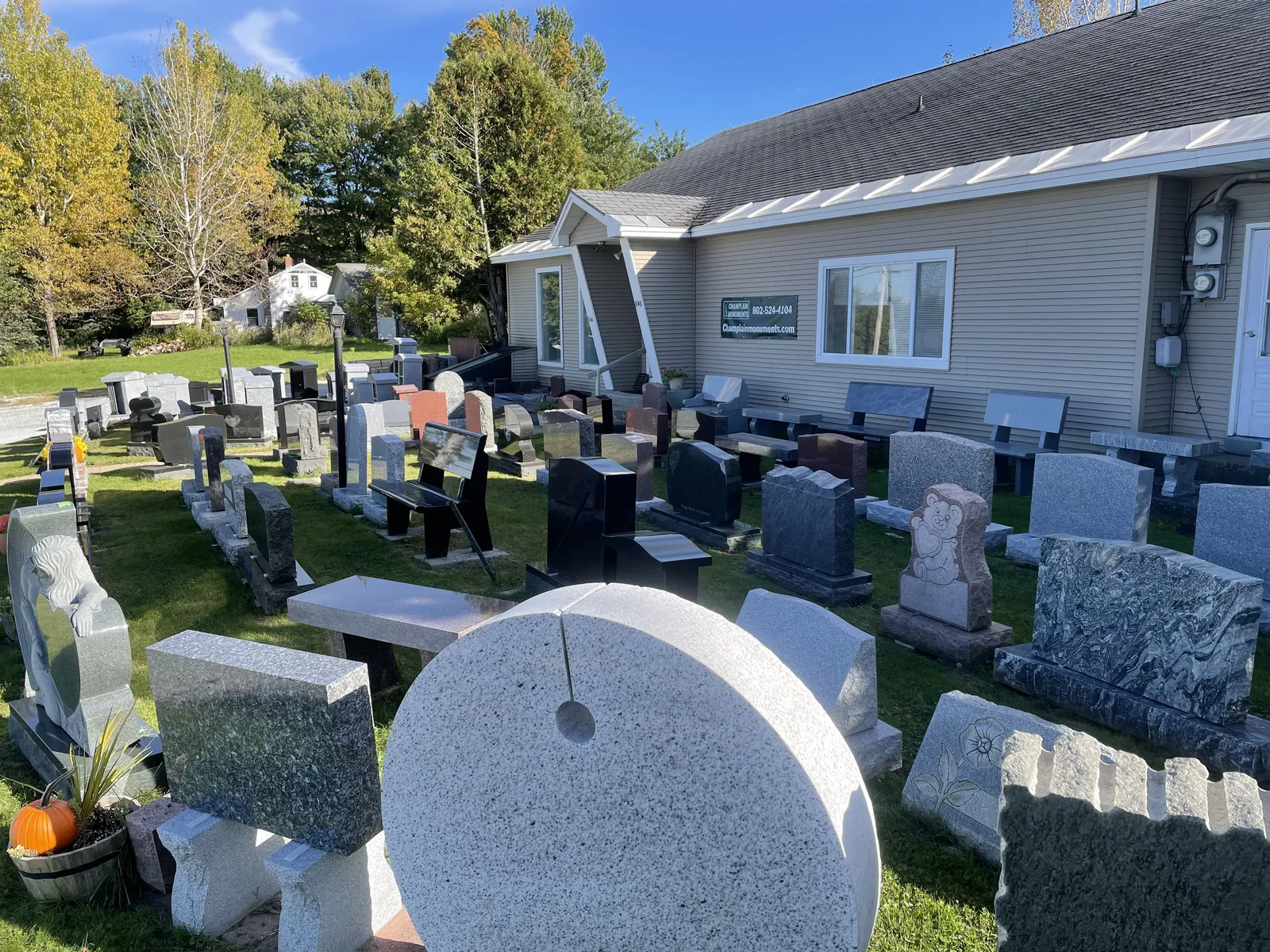 Variety of granite monuments on outdoor display at Champlain Monuments